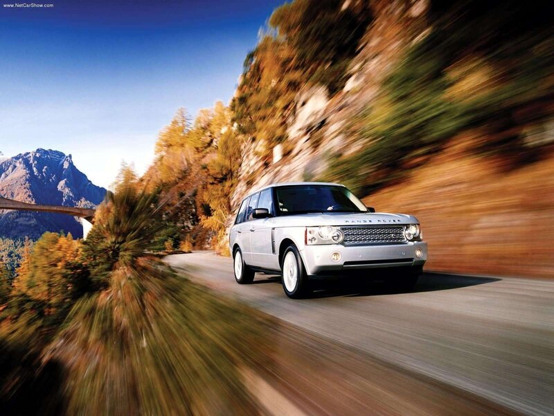 Silver Range Rover on mountain road