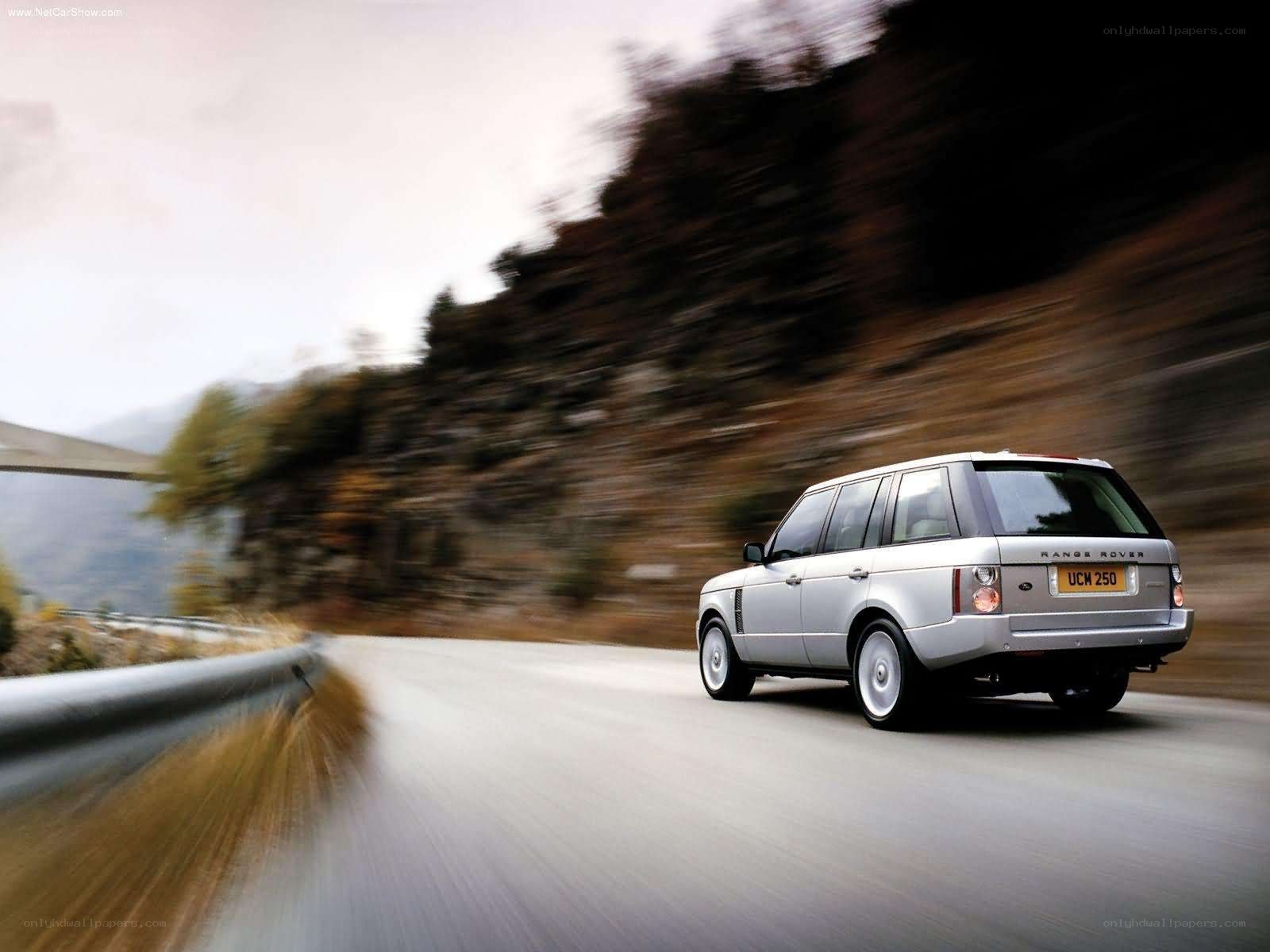 silver range rover on mountain road