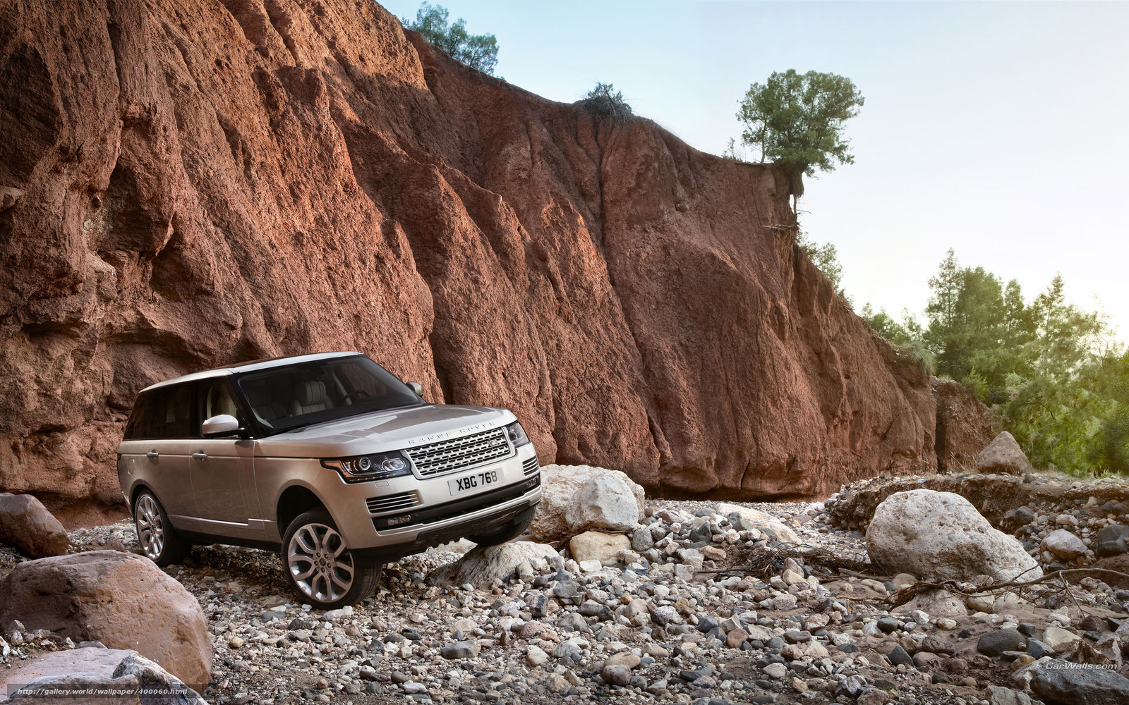 Silver Range Rover on rocky terrain