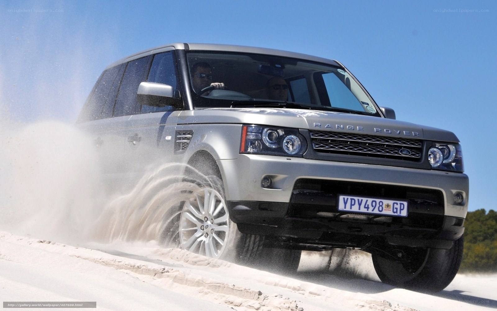 Silver Range Rover on sand dune