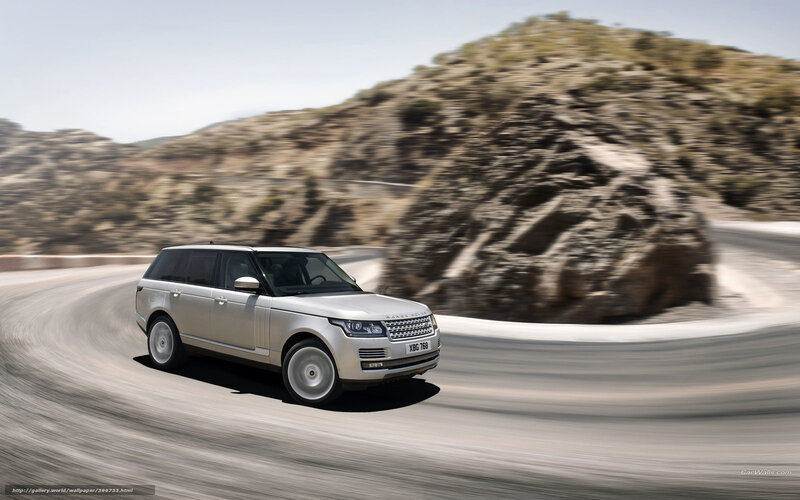 silver range rover on winding road