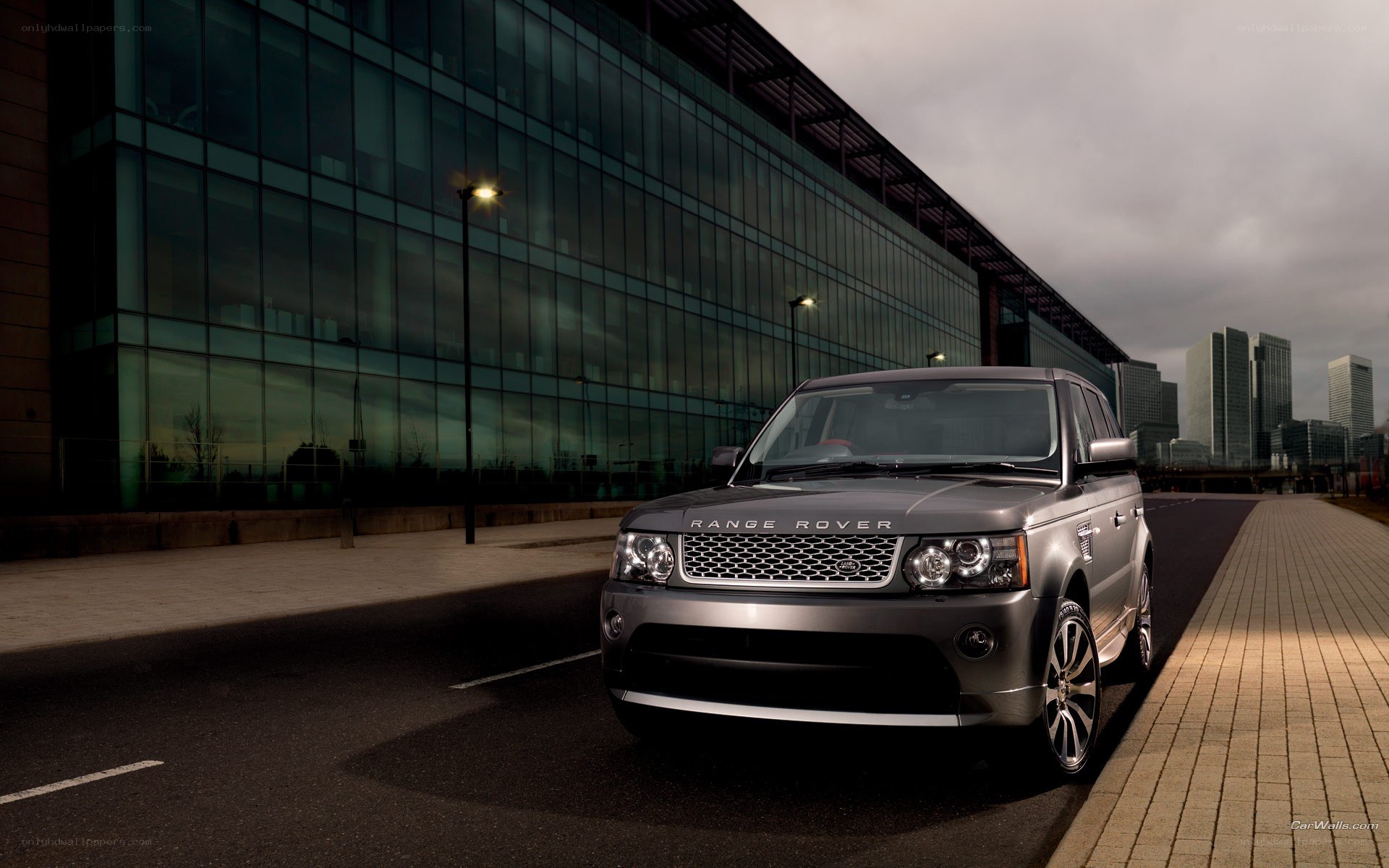 Silver Range Rover parked in city