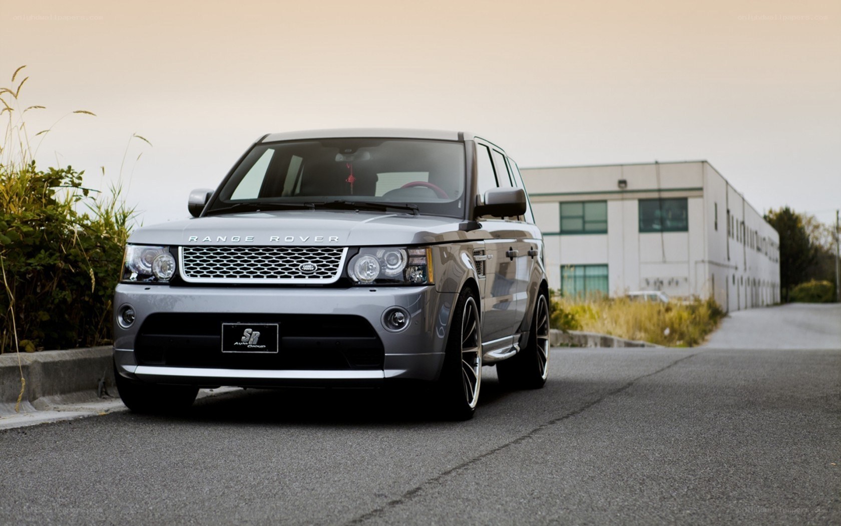 Silver Range Rover parked on road
