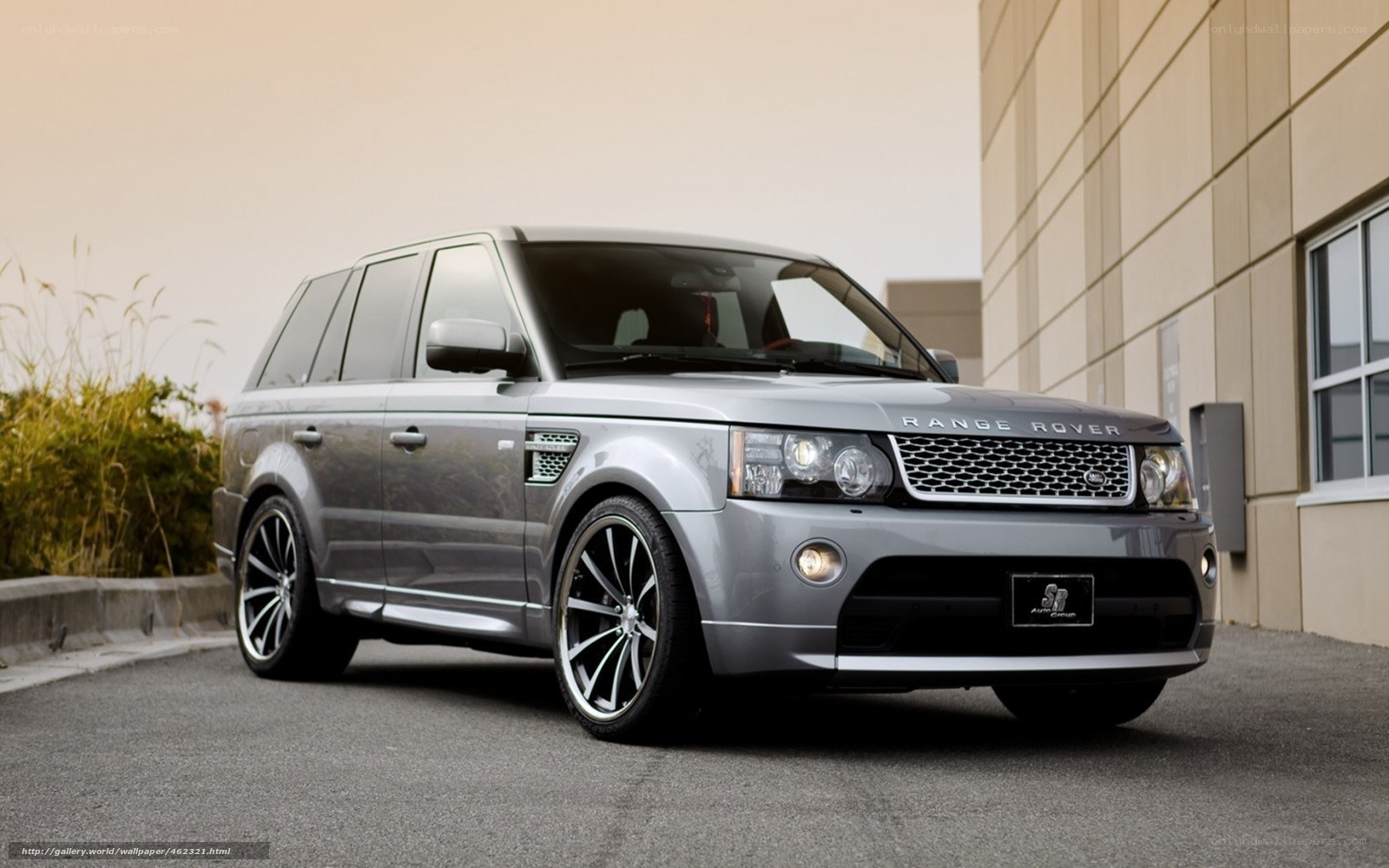 Silver Range Rover parked outside