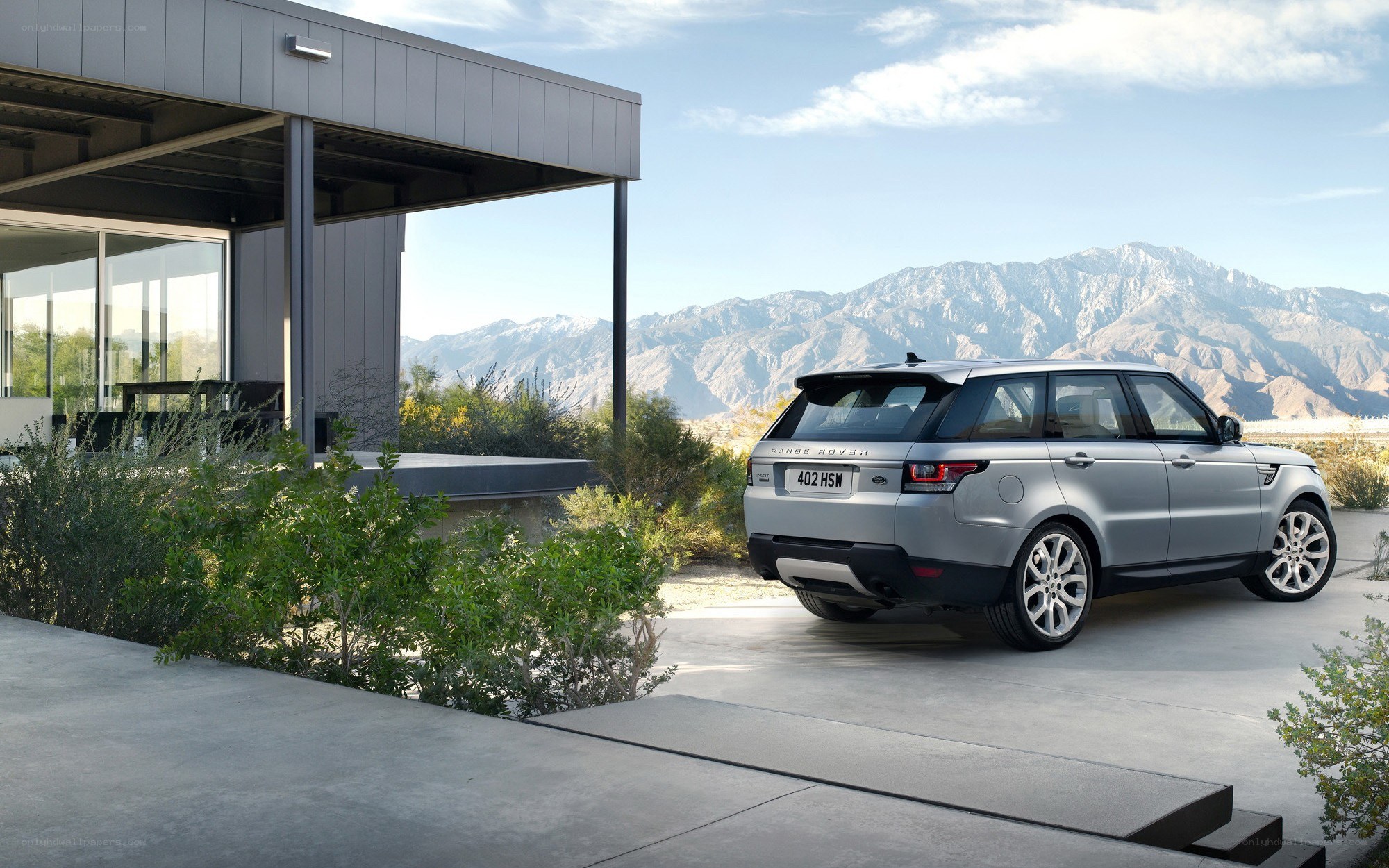 Silver Range Rover parked outside