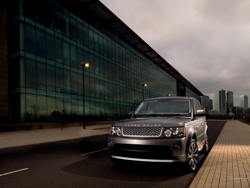 Silver Range Rover parked outside modern building