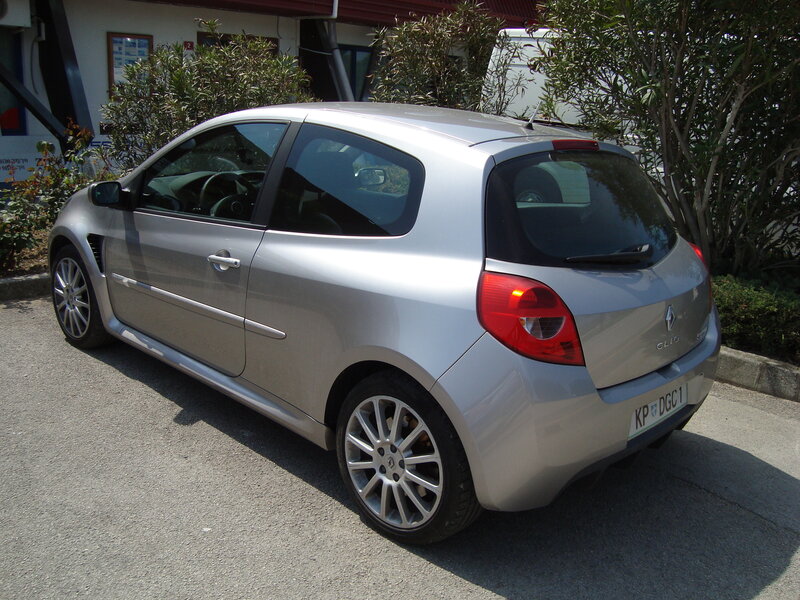 silver renault clio parked outside