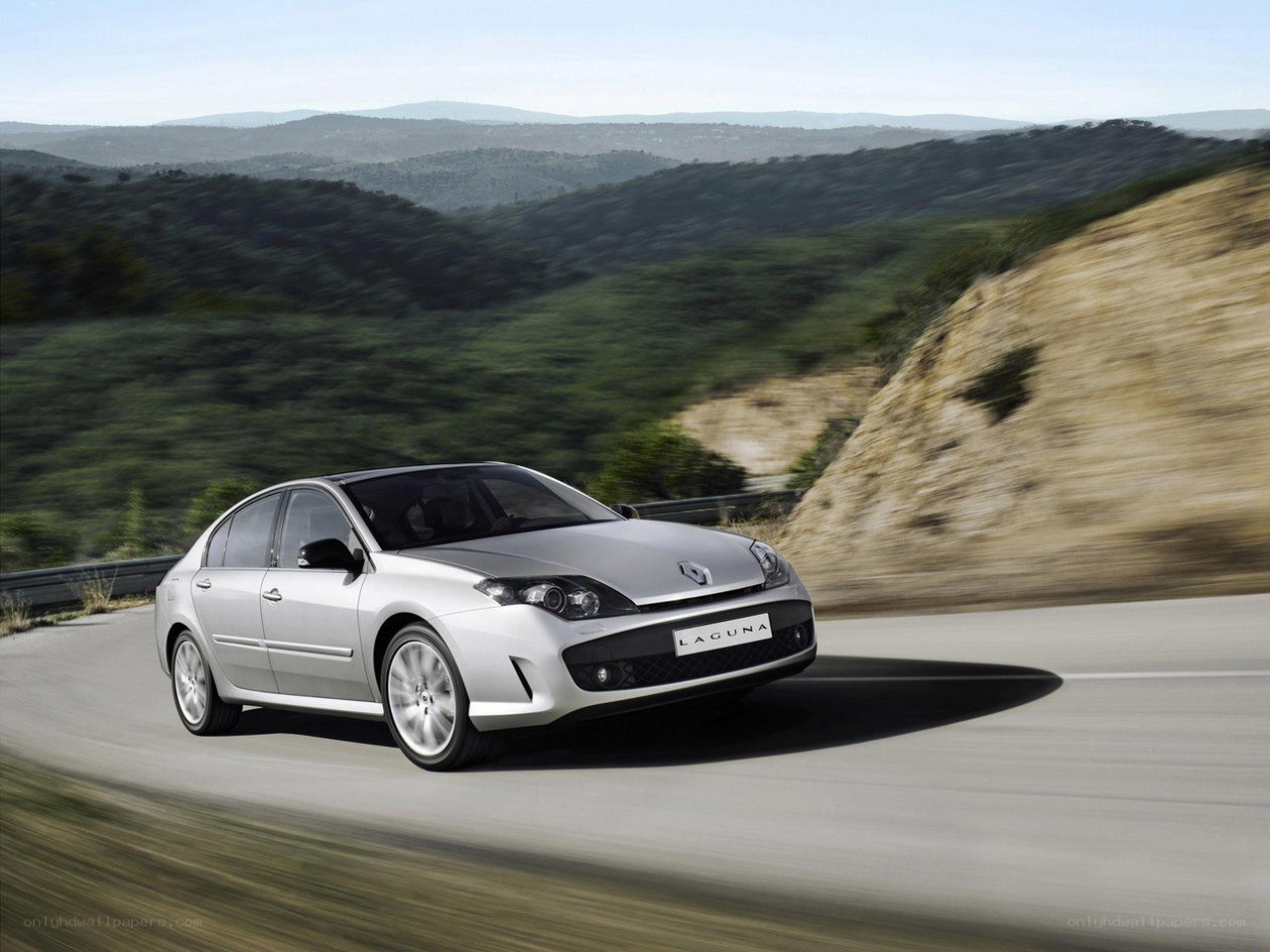 Silver Renault Laguna on a winding road