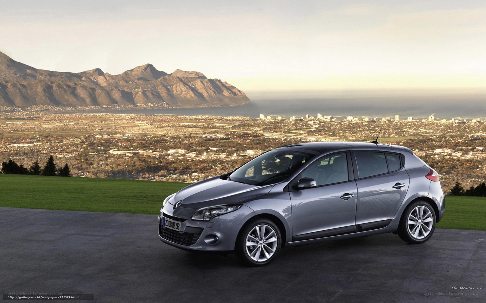 Silver Renault Megane parked on hill