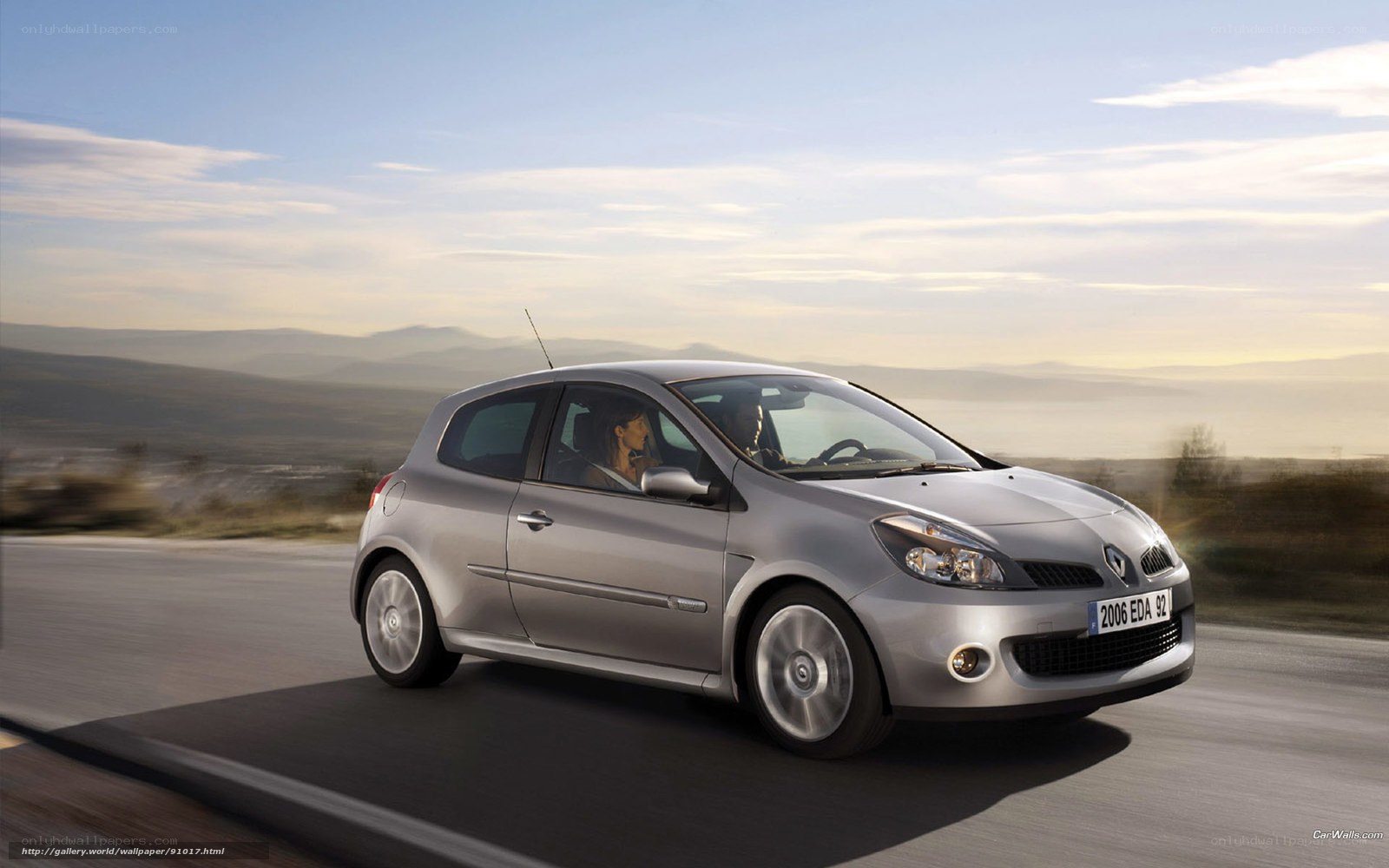 silver renault on a scenic road
