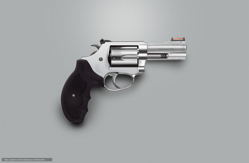 silver revolver on gray background