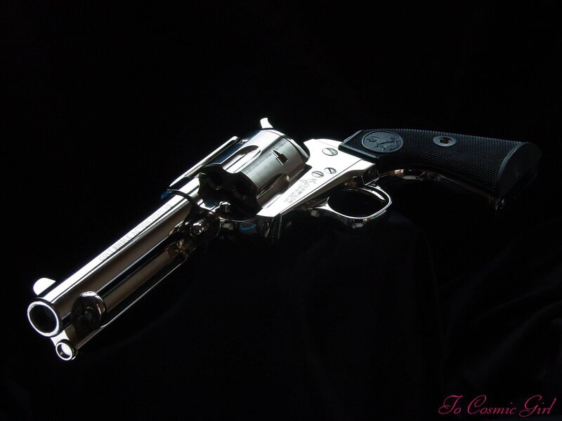 Silver Revolver with Black Grip — Dramatic