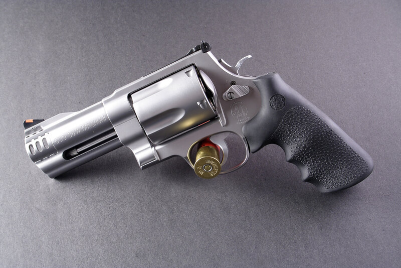 Silver Revolver with Bullet