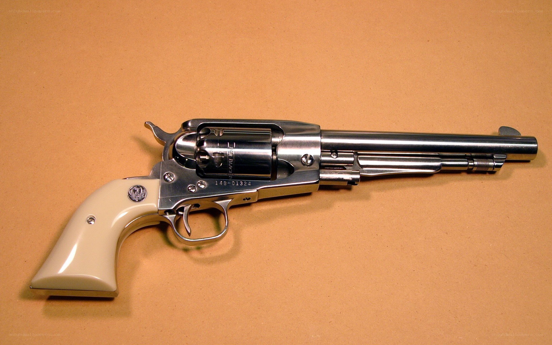 silver revolver with cream grip