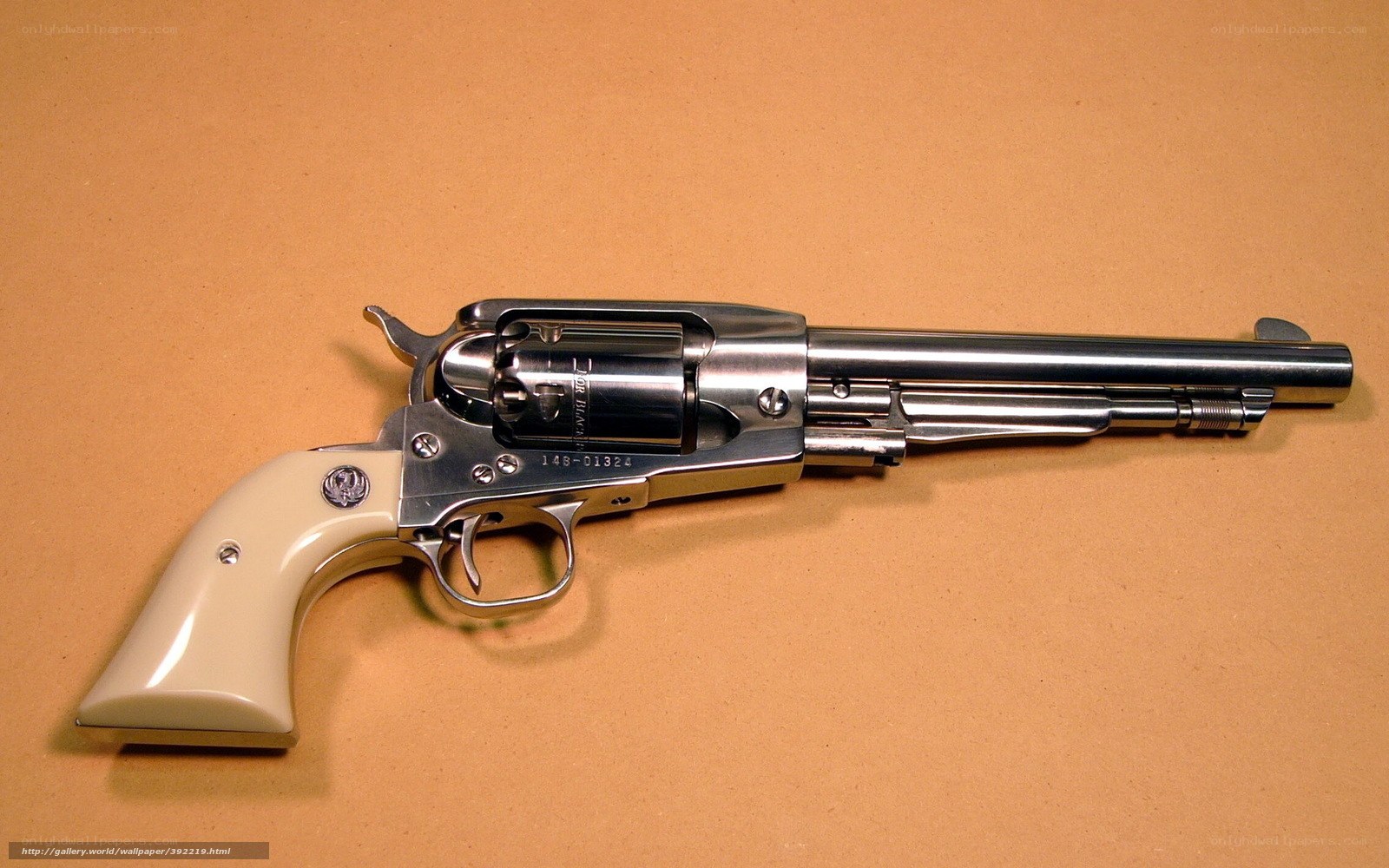 silver revolver with cream grip