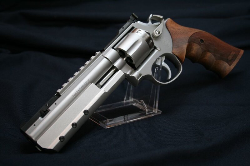 Silver Revolver with Wood Grip — Dramatic