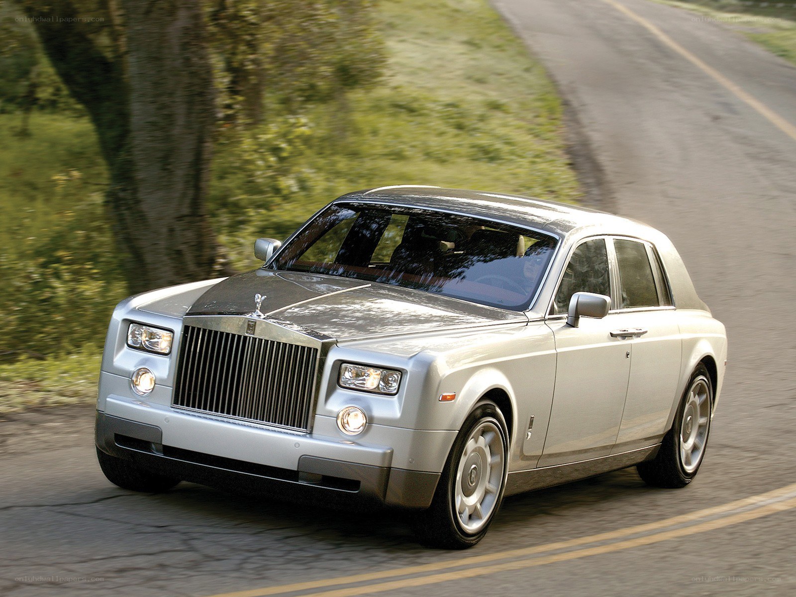 Silver Rolls-Royce on a country road