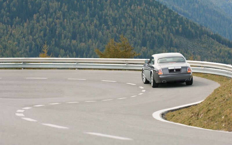 Silver Rolls-Royce on Road
