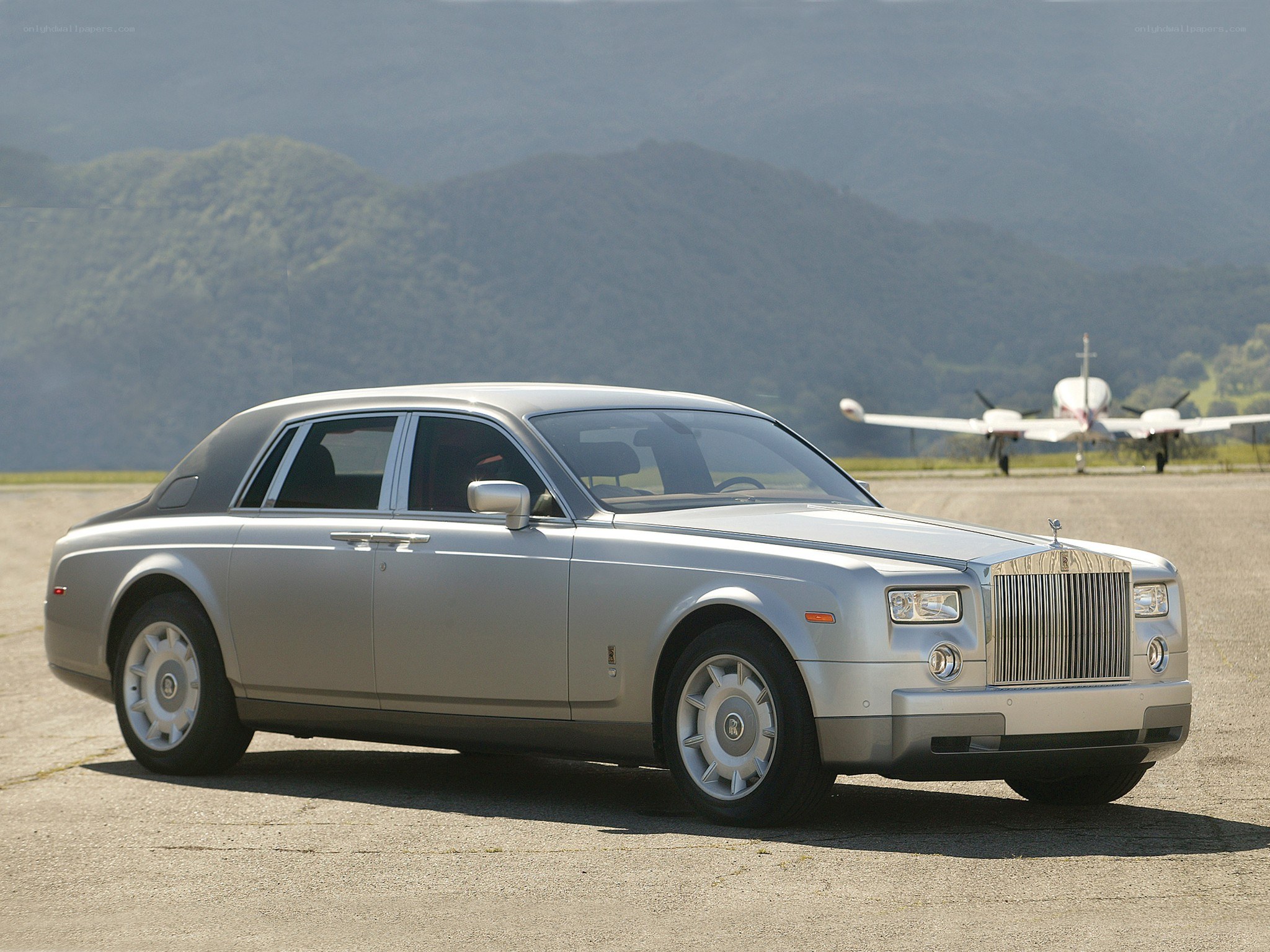 Silver Rolls-Royce on tarmac