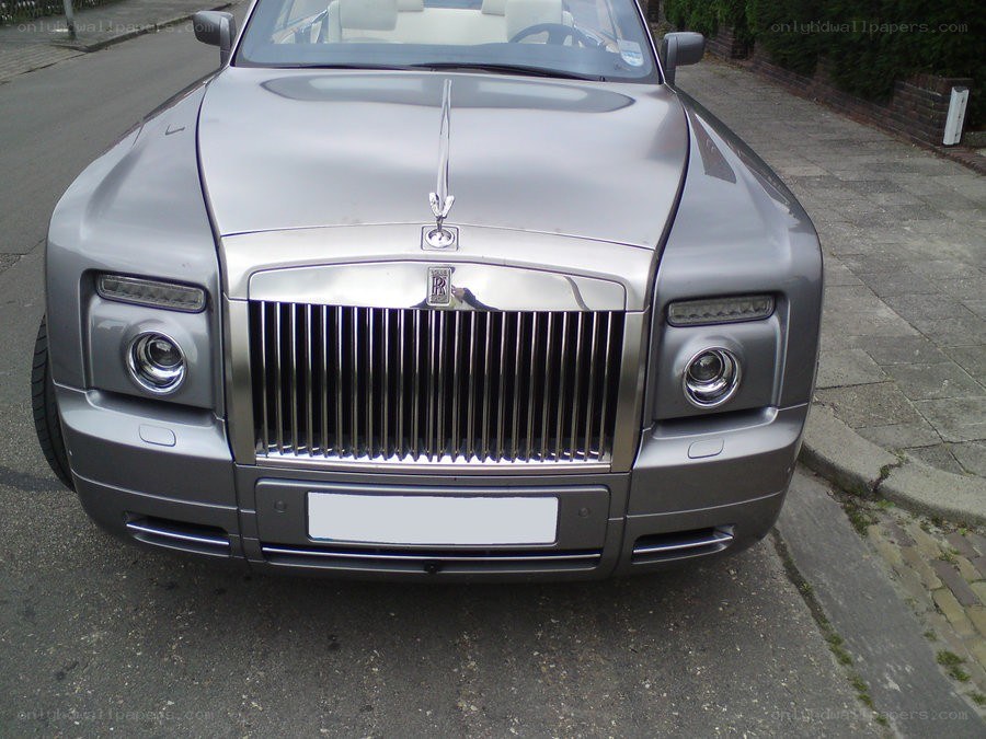 silver rolls-royce parked on street