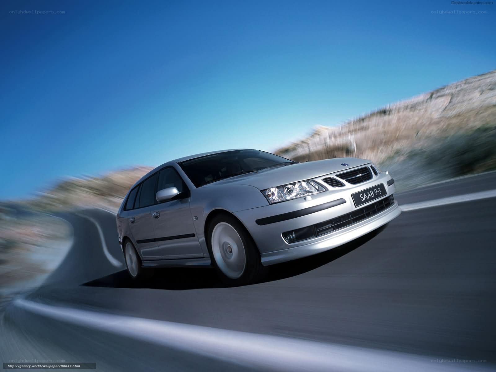 silver saab 9-3 in motion