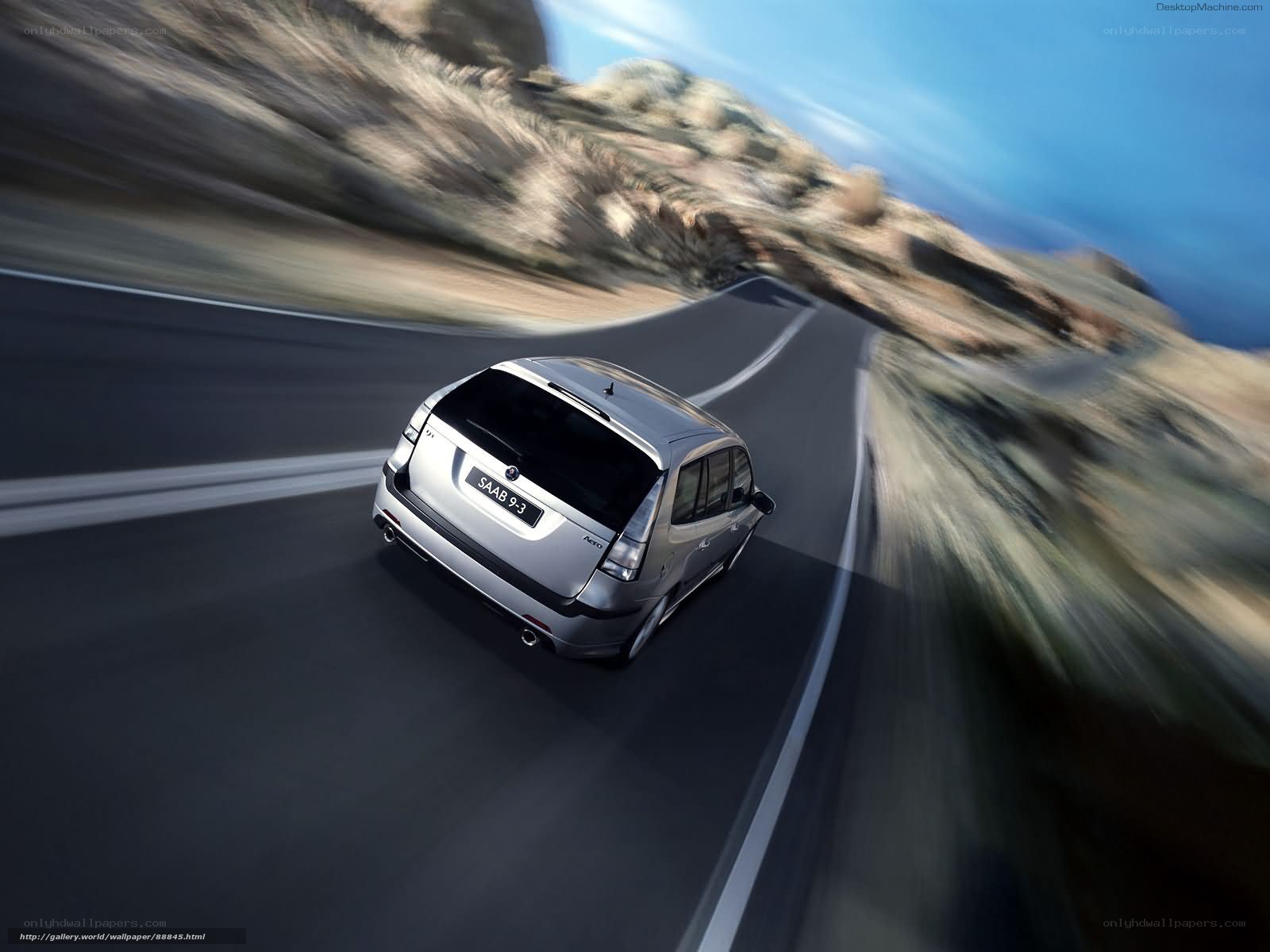 silver saab 9-3 on winding road