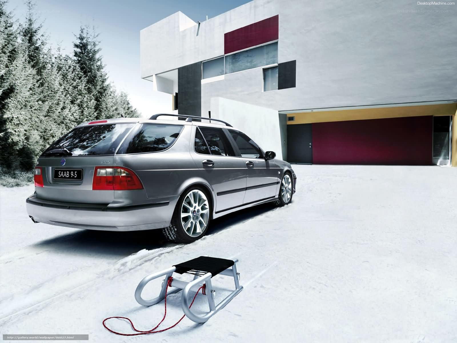 Silver Saab 9-5 in snowy setting
