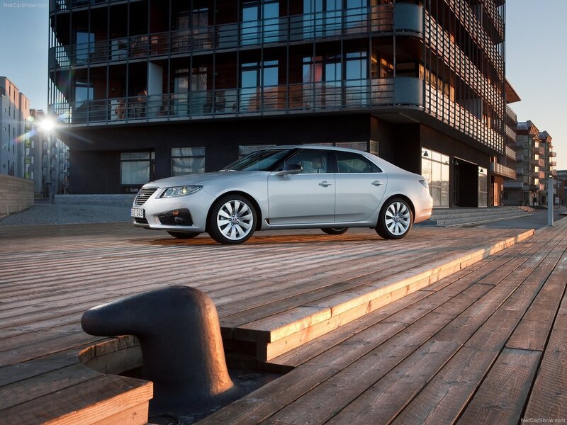 Silver Saab 9-5 on a wooden pier