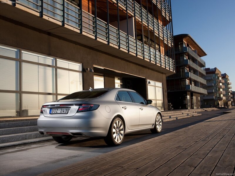 Silver Saab 9-5 parked on a boardwalk