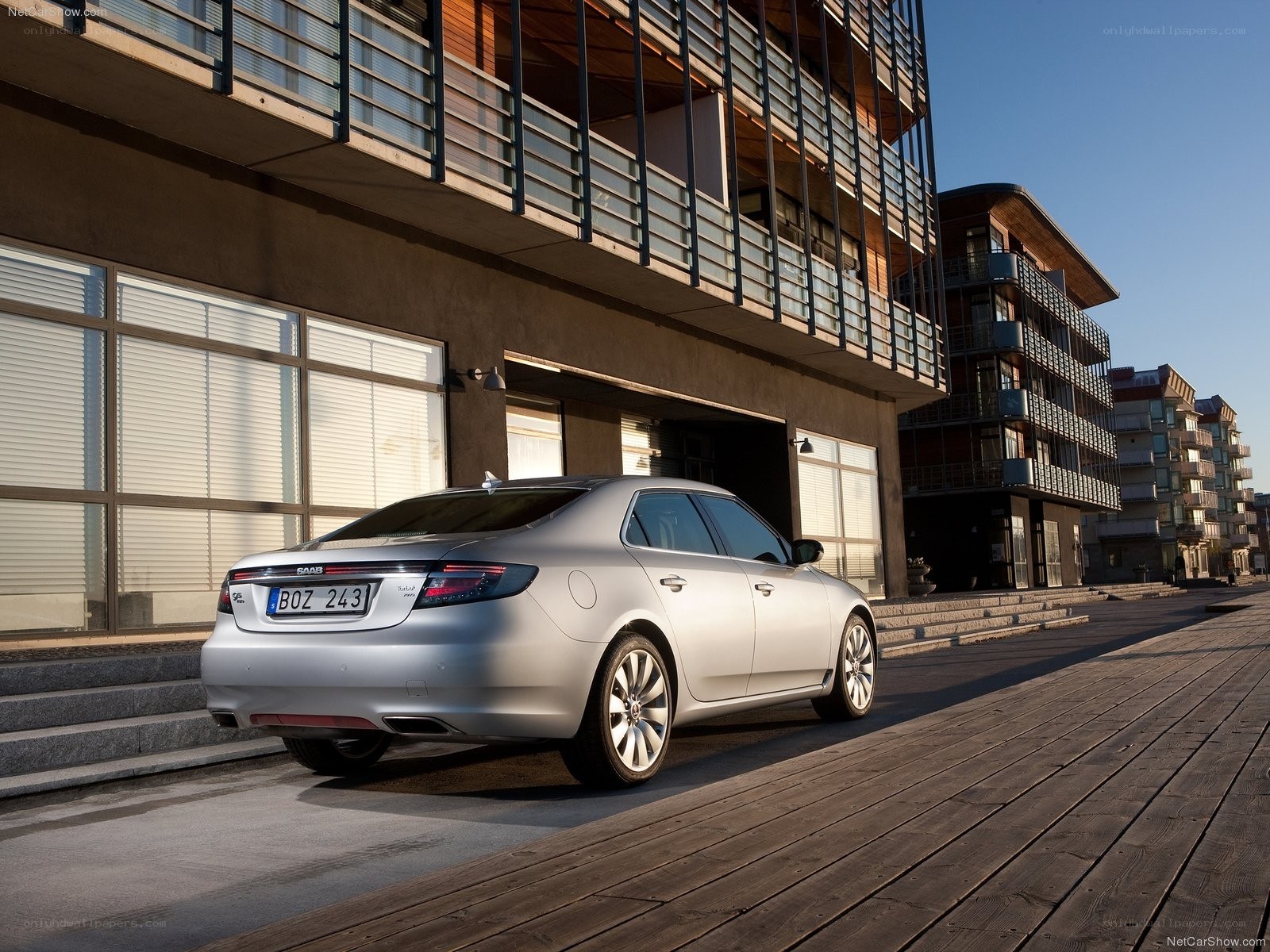 Silver Saab 9-5 parked on a boardwalk