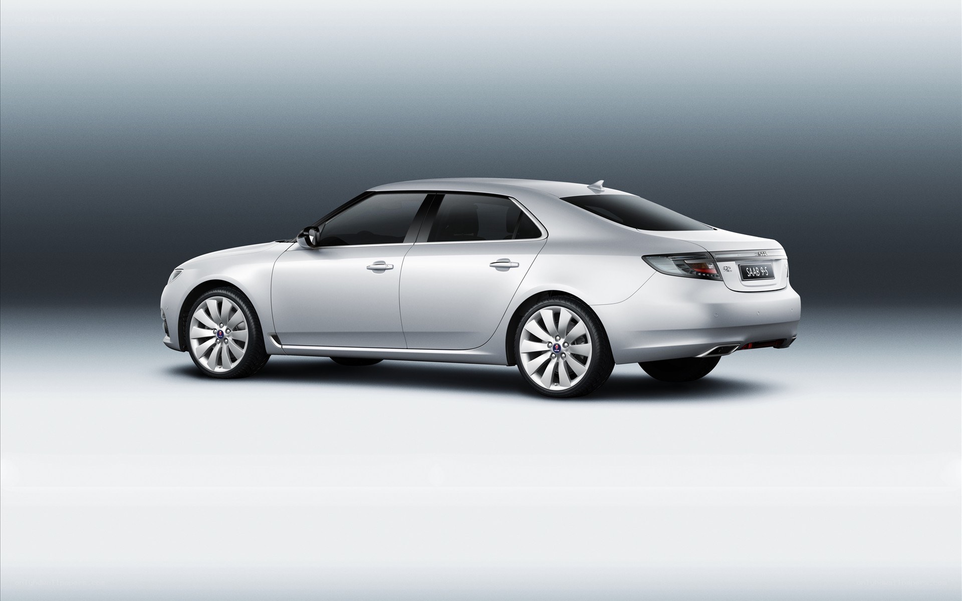 silver saab 9-5 sedan