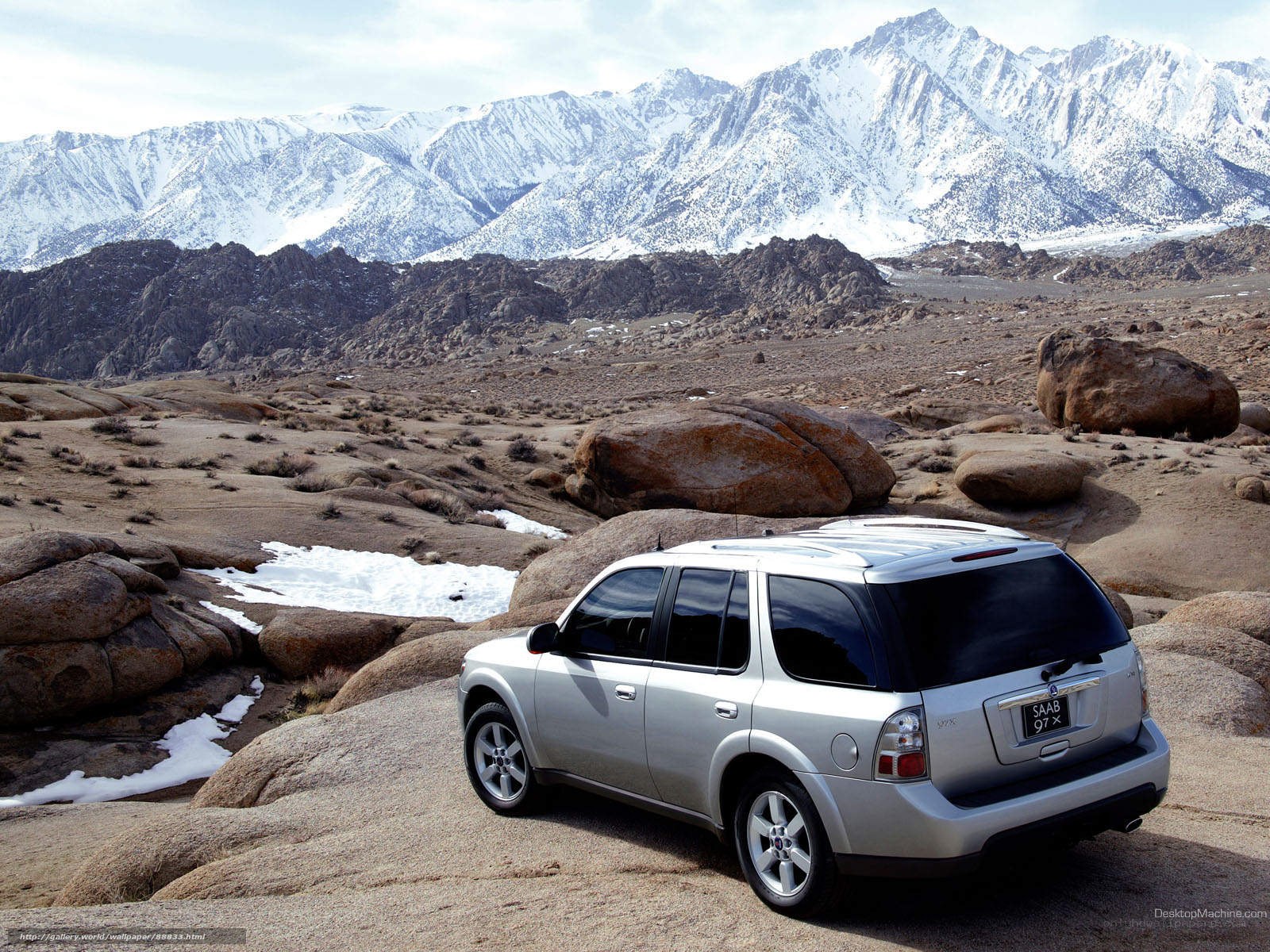Silver Saab 9-7X in mountain landscape