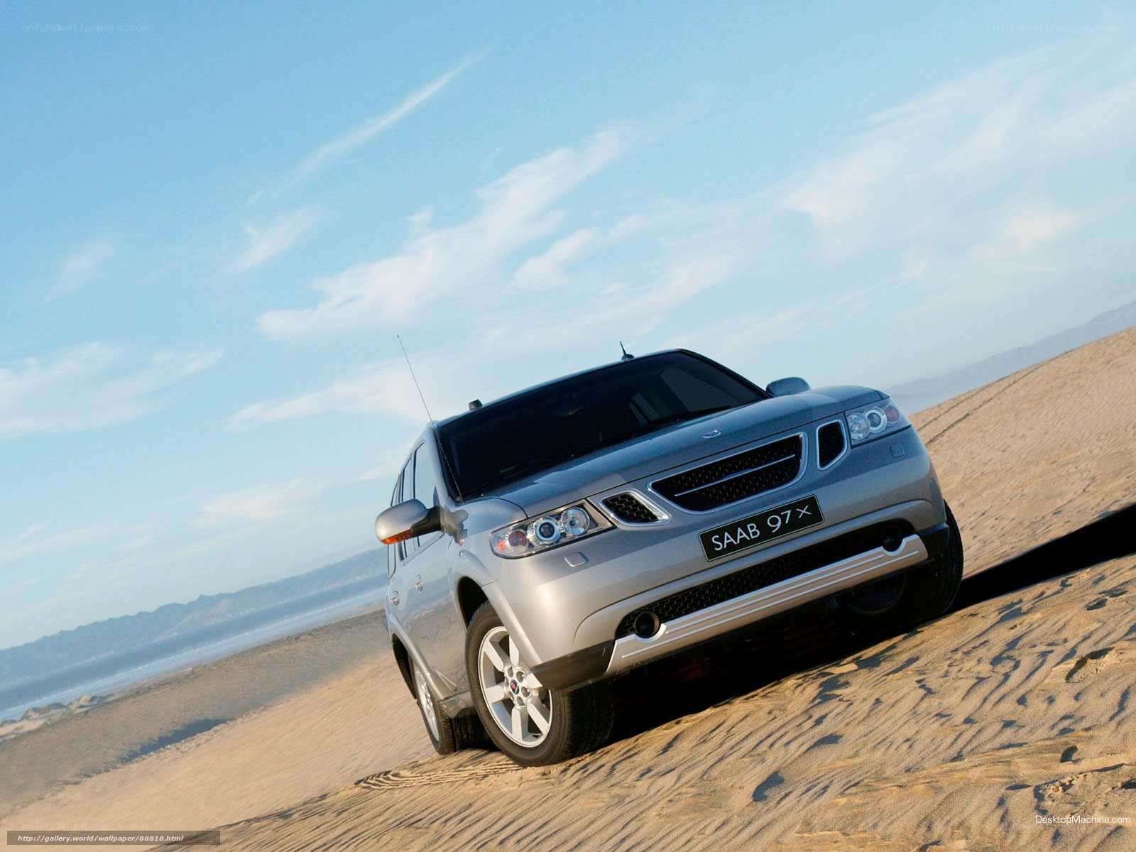 Silver Saab 9-7x on sand dune
