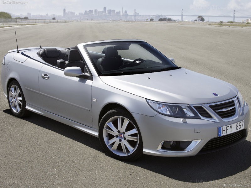 silver saab convertible on tarmac