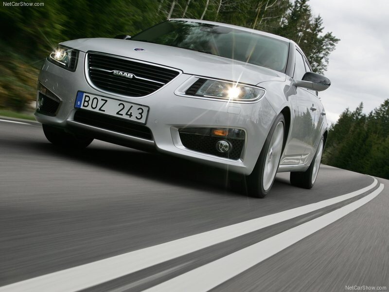 silver saab driving on road