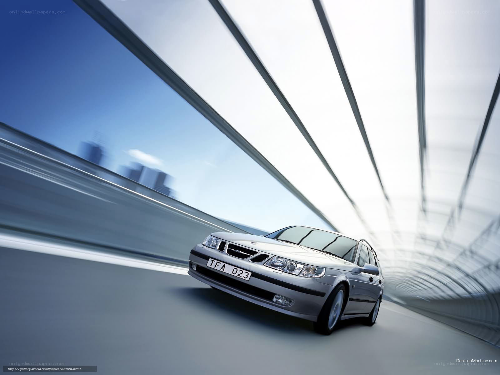 Silver Saab on a modern bridge