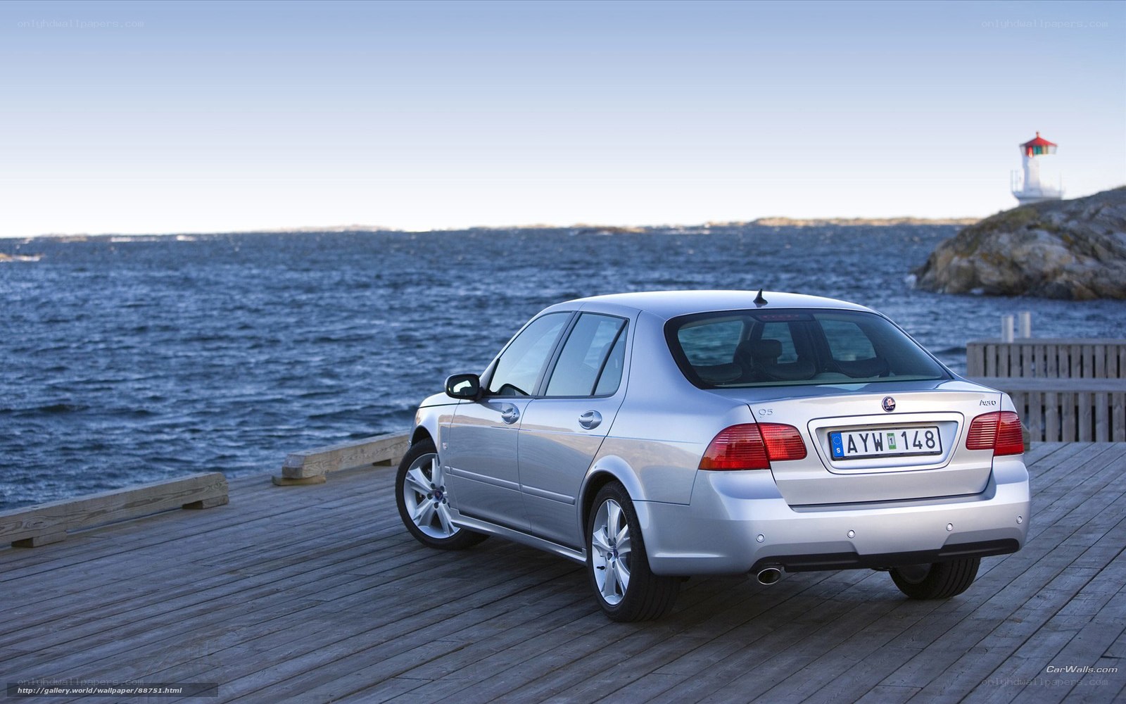 Silver Saab on a wooden pier
