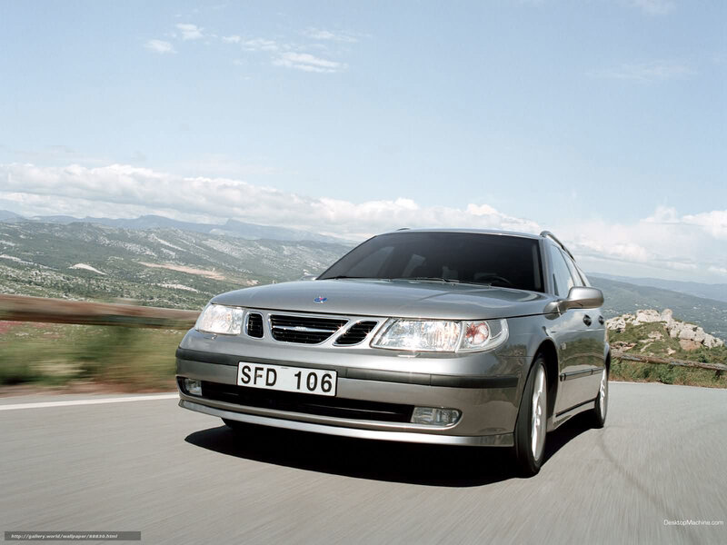 silver saab on mountain road