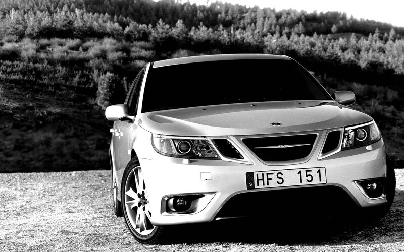 Silver Saab parked outdoors