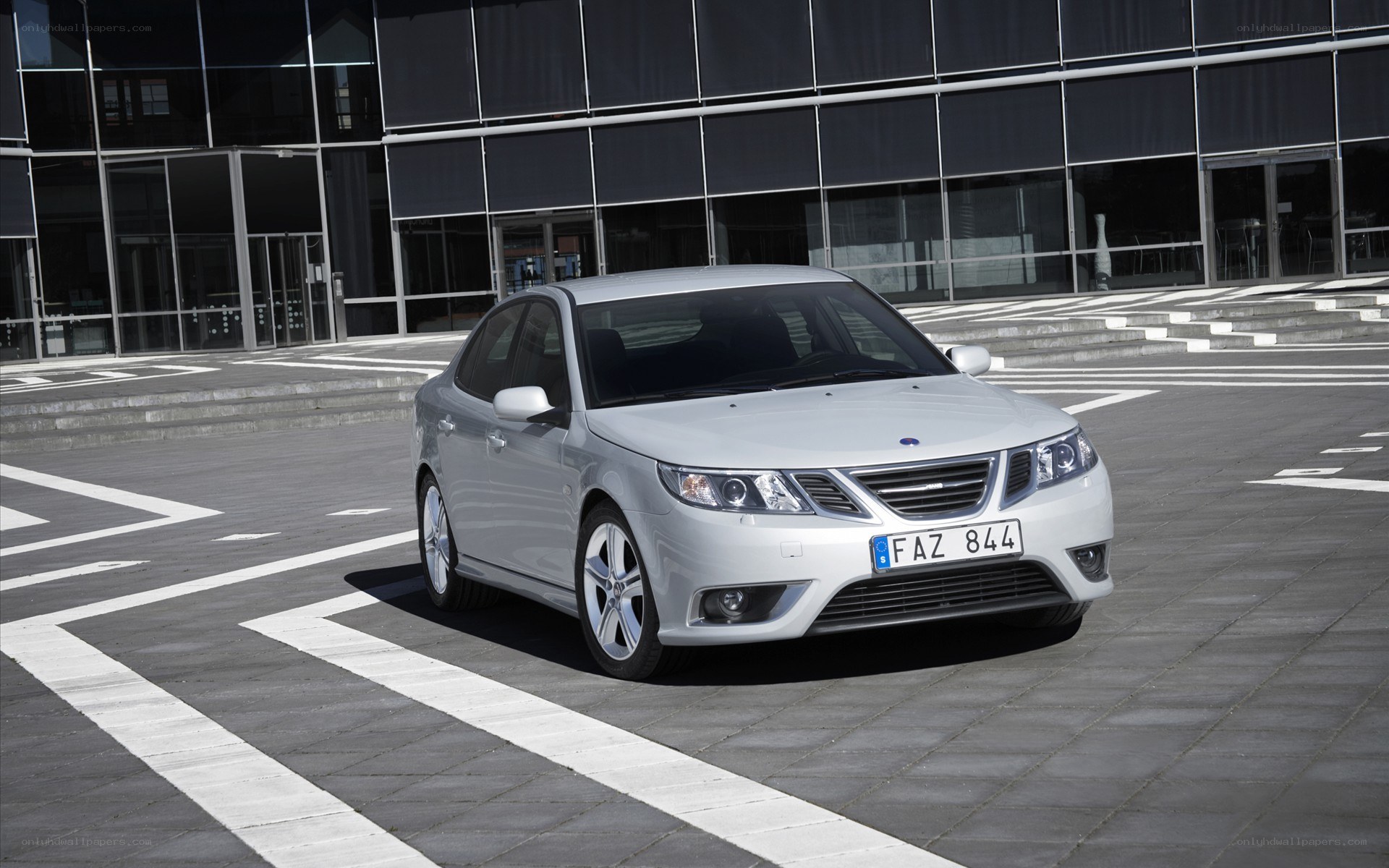 Silver Saab sedan in parking lot