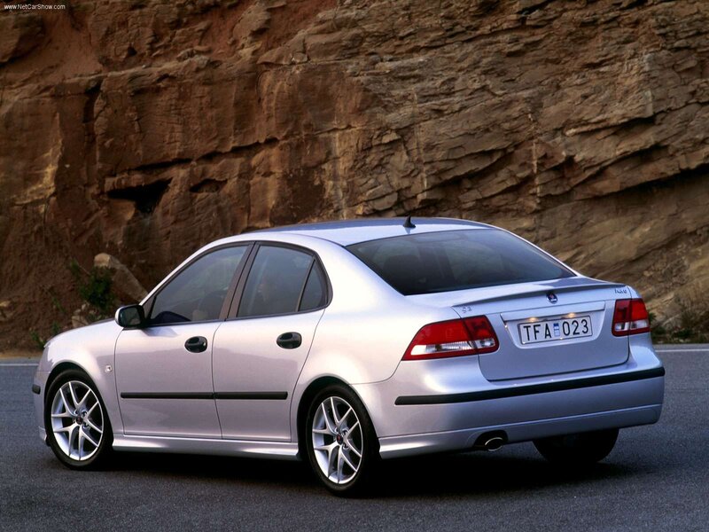 silver saab sedan on road
