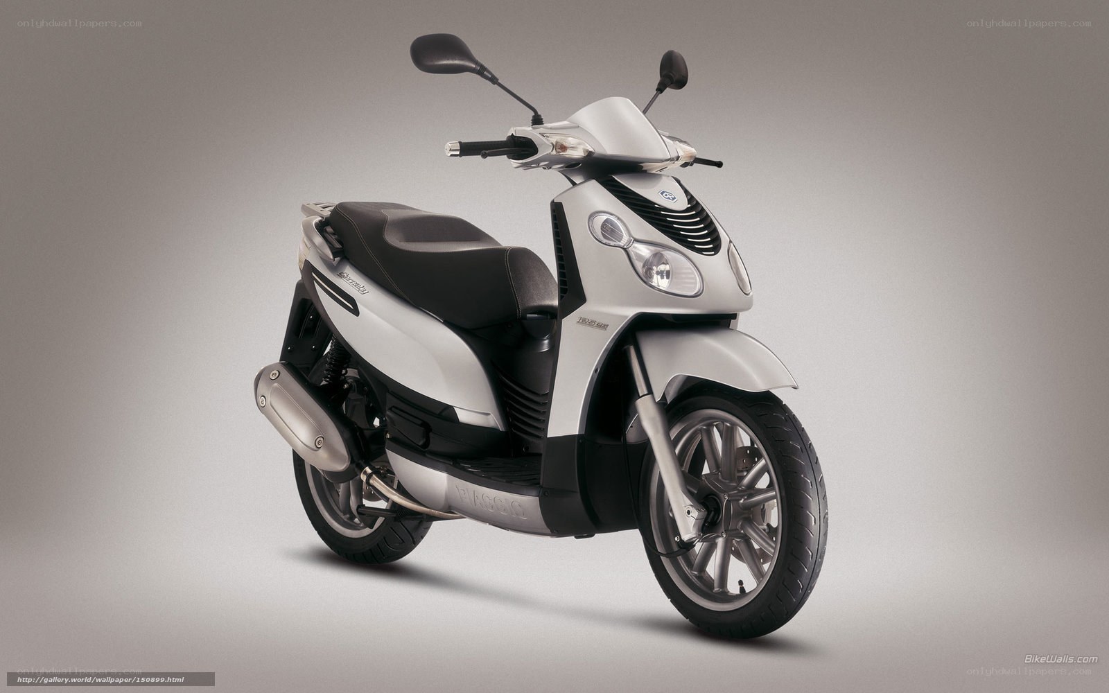 silver scooter on gray background