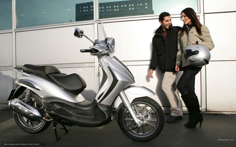 Silver Scooter with Couple
