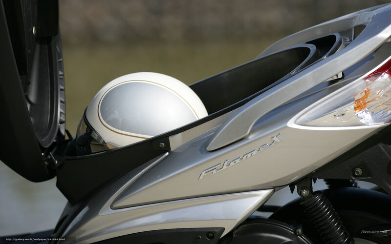 Silver scooter with helmet