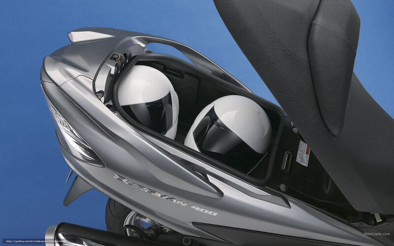 Silver scooter with helmets