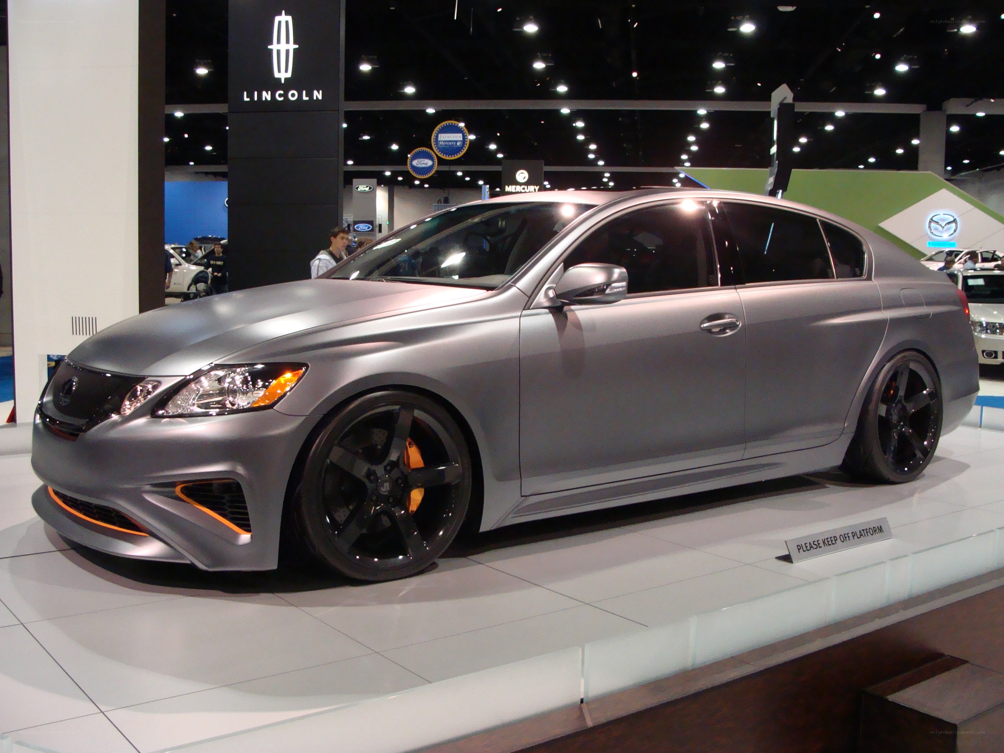 silver sedan at auto show