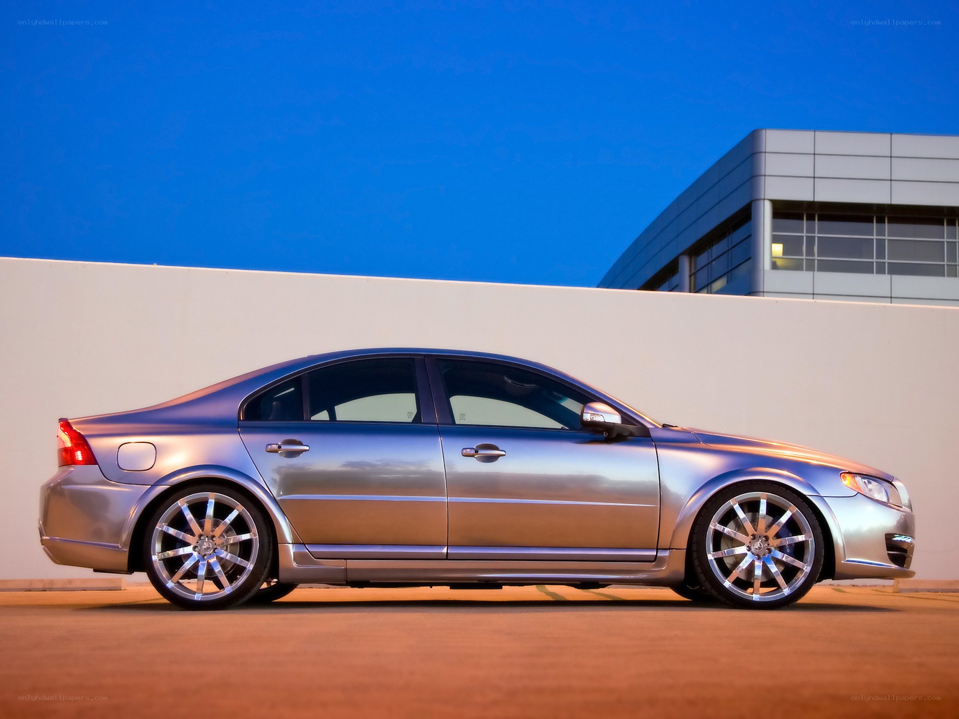 silver sedan at dusk
