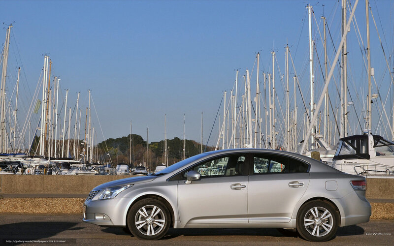 Silver sedan at marina