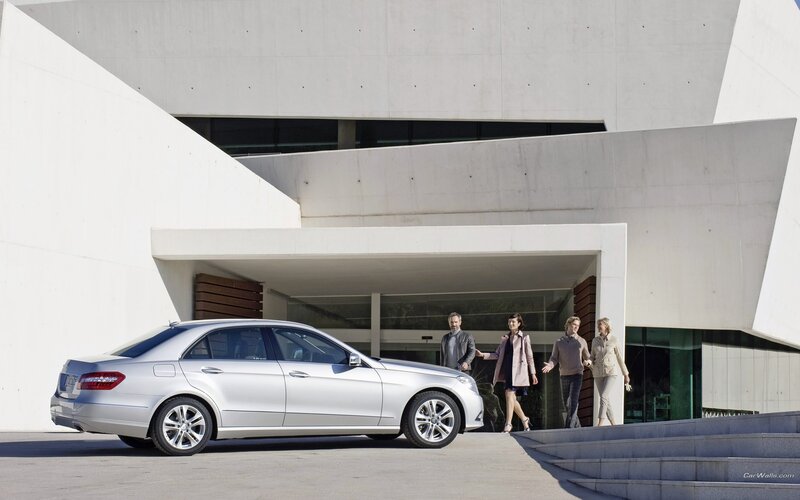 Silver sedan at modern building