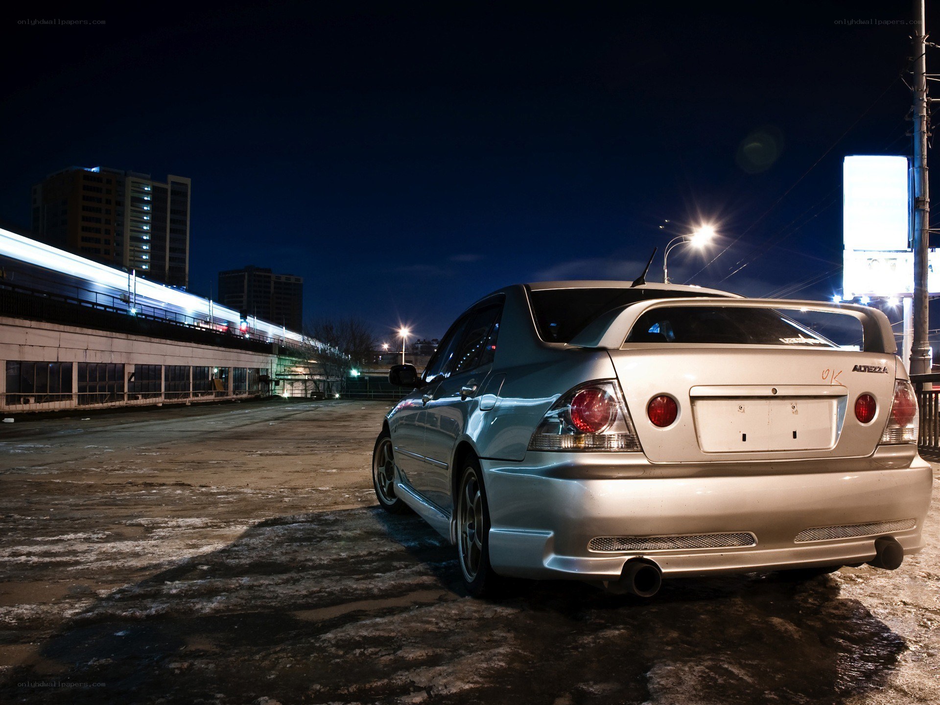 Silver sedan at night